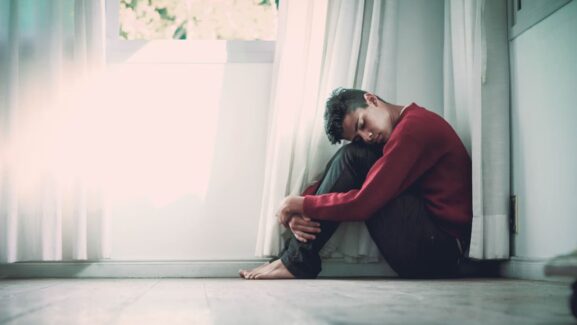 Man sitting on floor