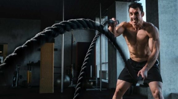 Man working out with ropes