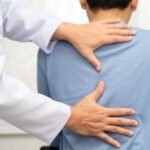 Chiropractor with patient