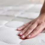 Hand on mattress