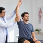 Physiotherapy session with two males